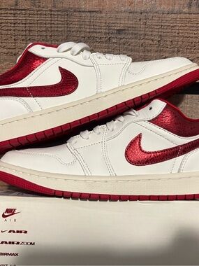 Nike Air Jordan’s White and Metallic crackle Red Low-Top Sneakers